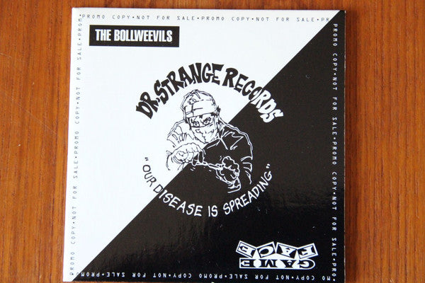 The Bollweevils / Gameface – Dr. Strange Records: Our Disease Is Spreading - CD Promo Sampler - 1995 - Dr. Strange Records – DSR-A - Buen Estado / Good Condition (VG+ / VG) - Sticker Residue on Front Cover
