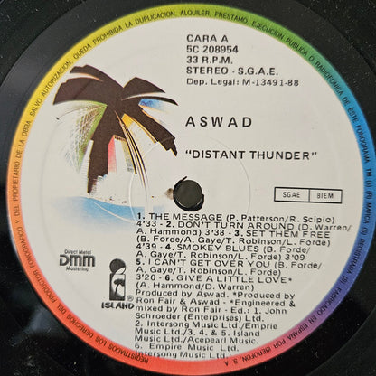 Aswad – Distant Thunder - LP - Edición Española / Spanish Edition - 1988 - Island Records – 5C 208954 - Muy Buen Estado / Very Good Condition (VG+ / VG+)